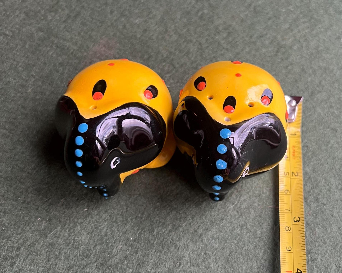 Quirky elephant salt and pepper shakers. Signed to base SUNA SA.