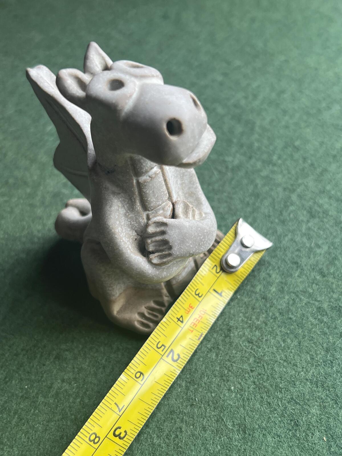 Hand built pottery dragon figurine. Grey clay ready to be painted dragon.