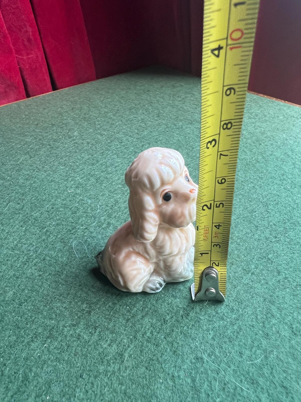 Vintage sad poodle puppy figurine. Bone China Dog ornament. Original sticker.