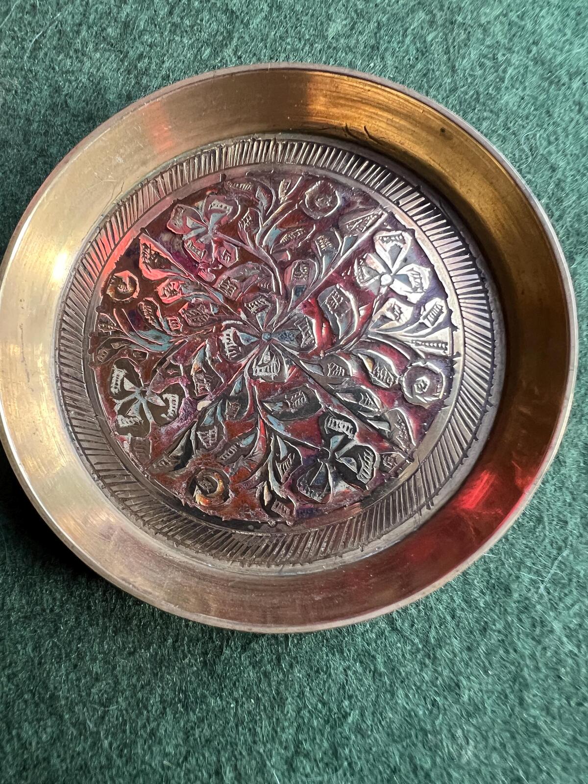 Decorative brass trinket tray. Engraved intricate red pattern. Made in India.