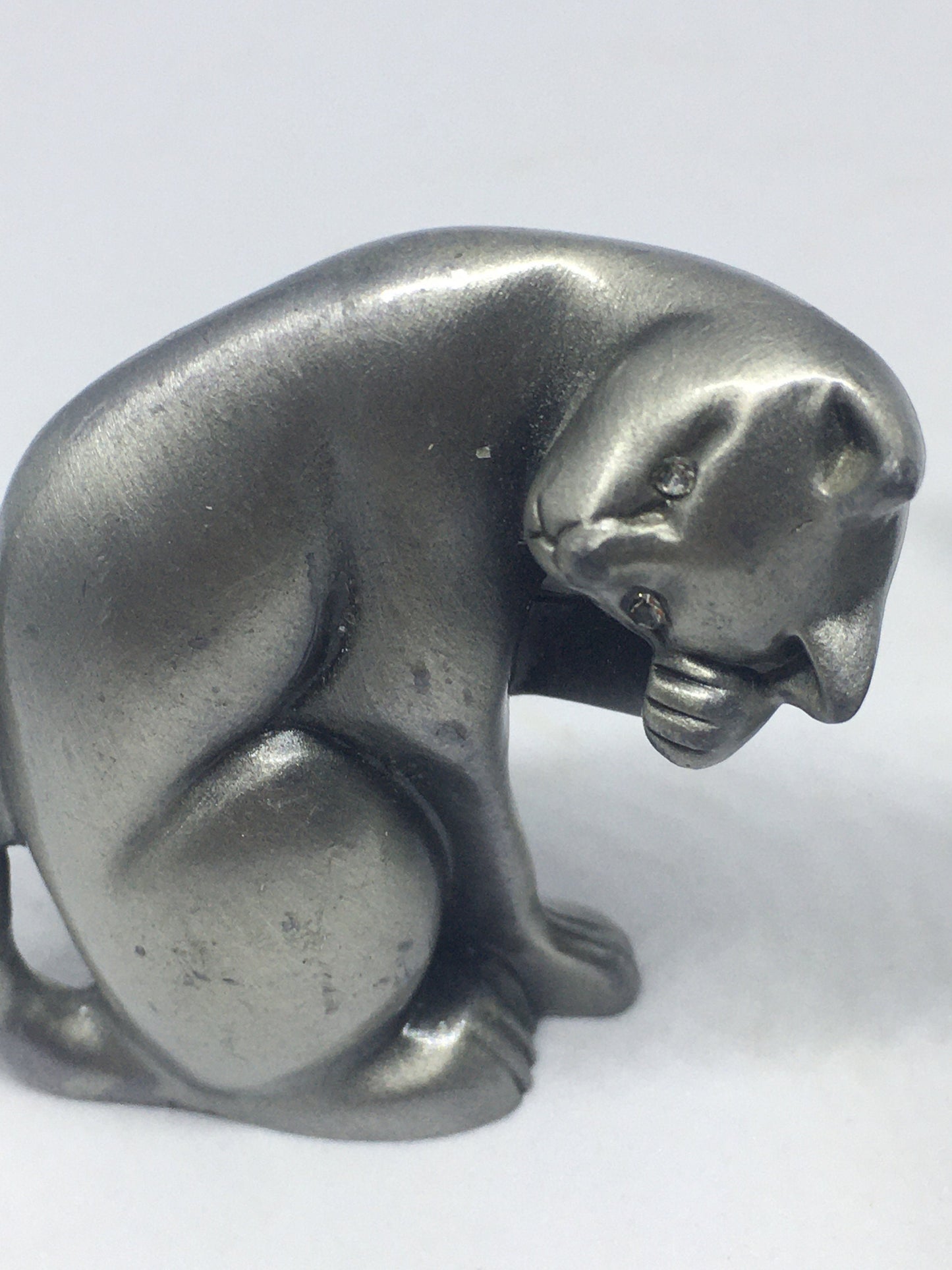 Two pewter cats.
