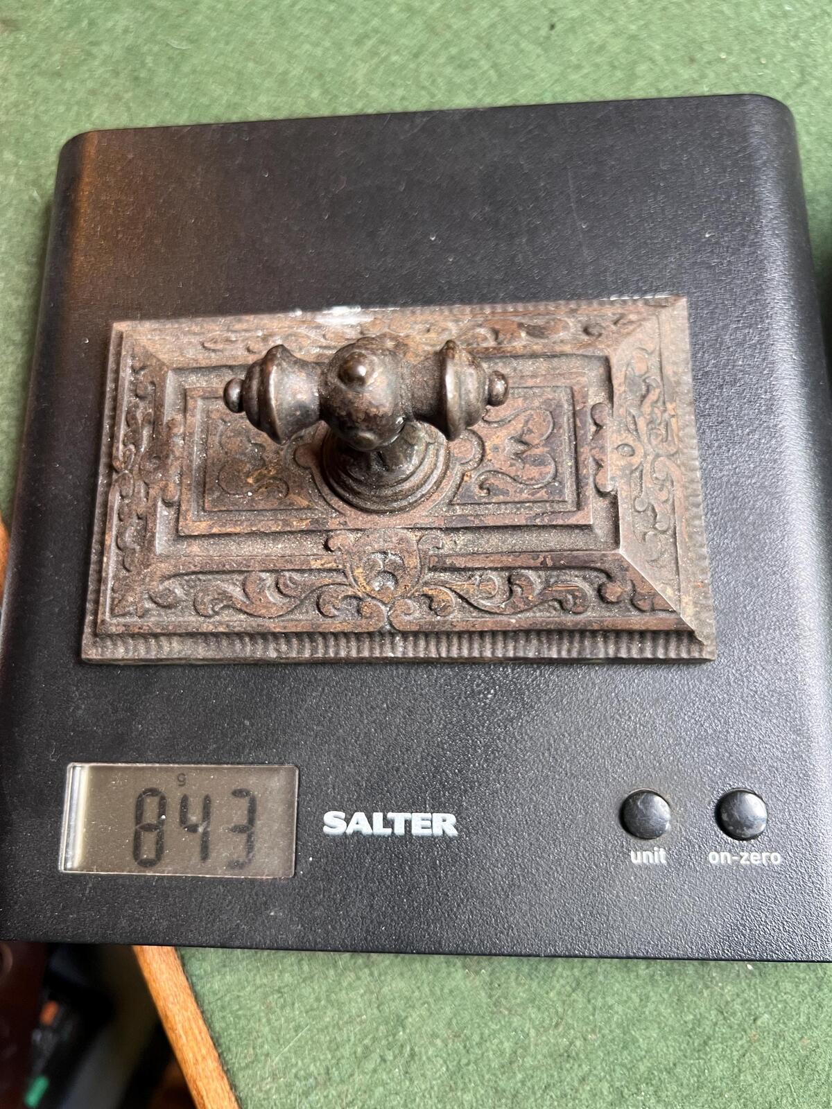 Ornate antique cast iron paperweight. Handled Victorian paperweight doorstop. Decorative pyramid swirl patterned quirky paperweight.