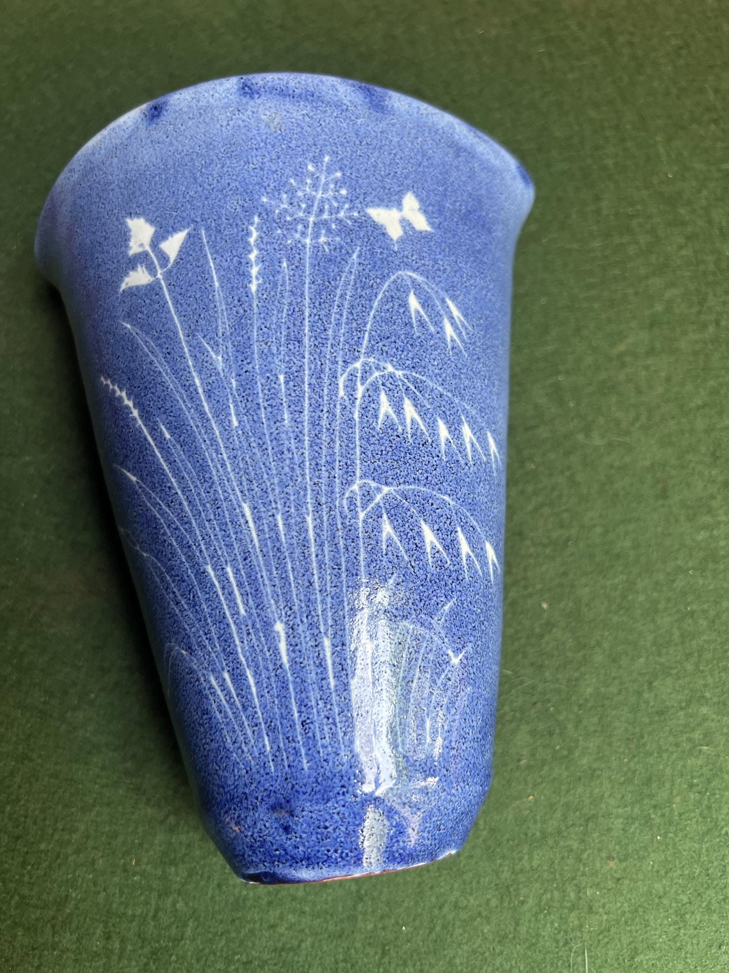 Studio pottery wall pocket. Blue glaze posy vase floral butterfly decor.