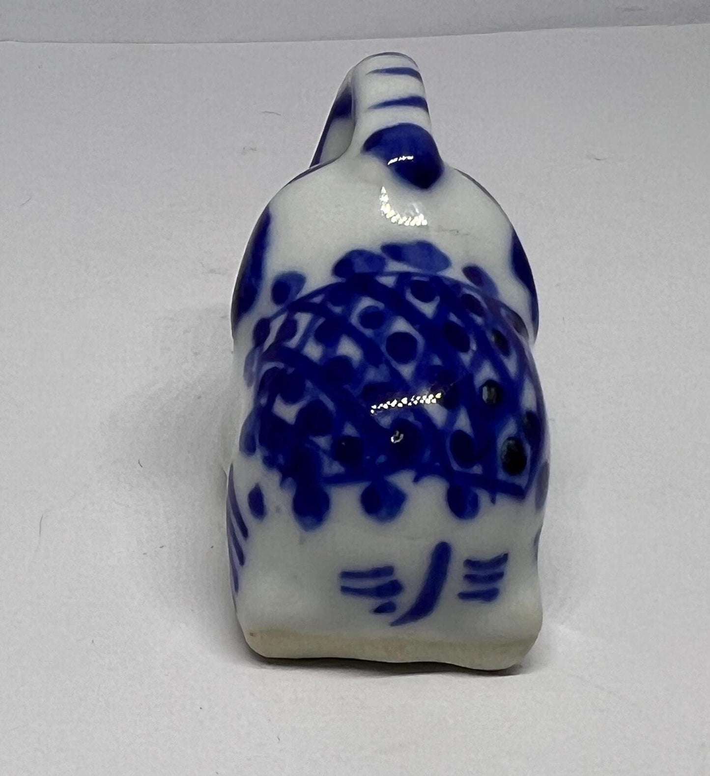 Lucky trunk up sitting elephant ornament. Blue white vintage elephant.