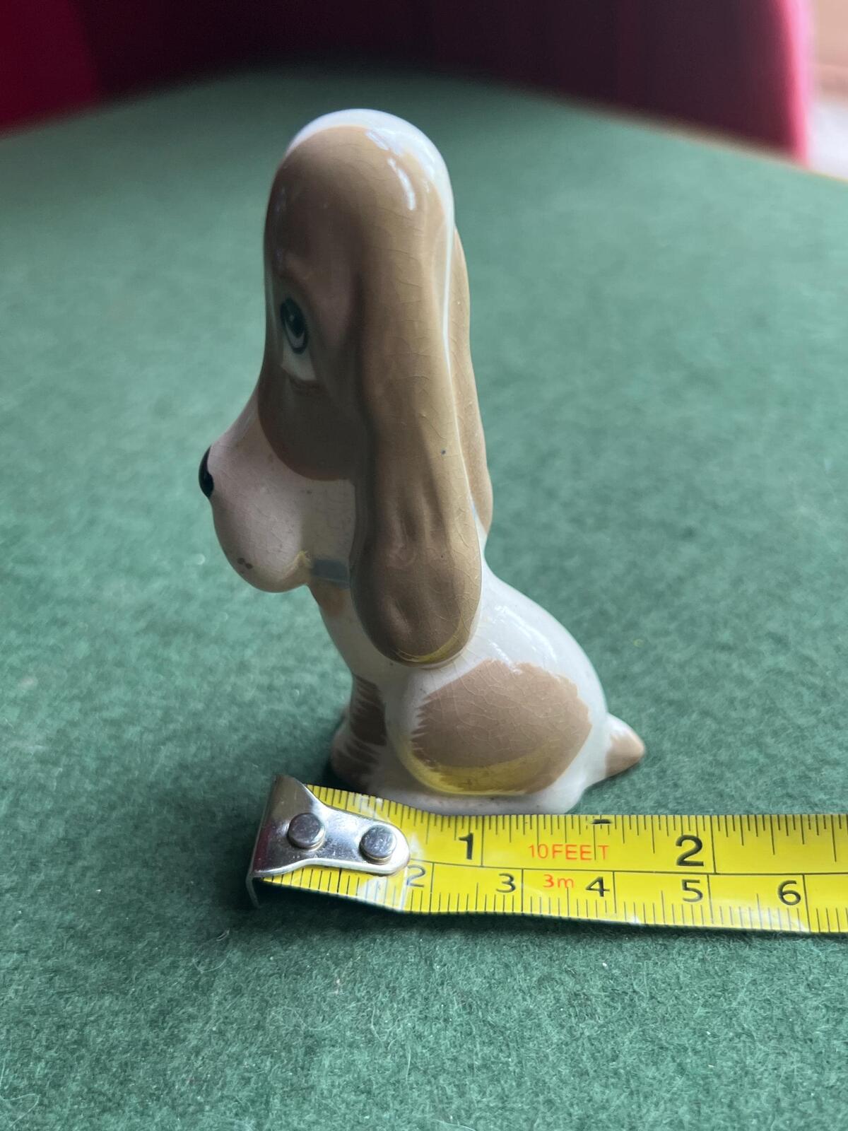 Vintage ceramic sad hound dog figurine. Stamped Szeiler