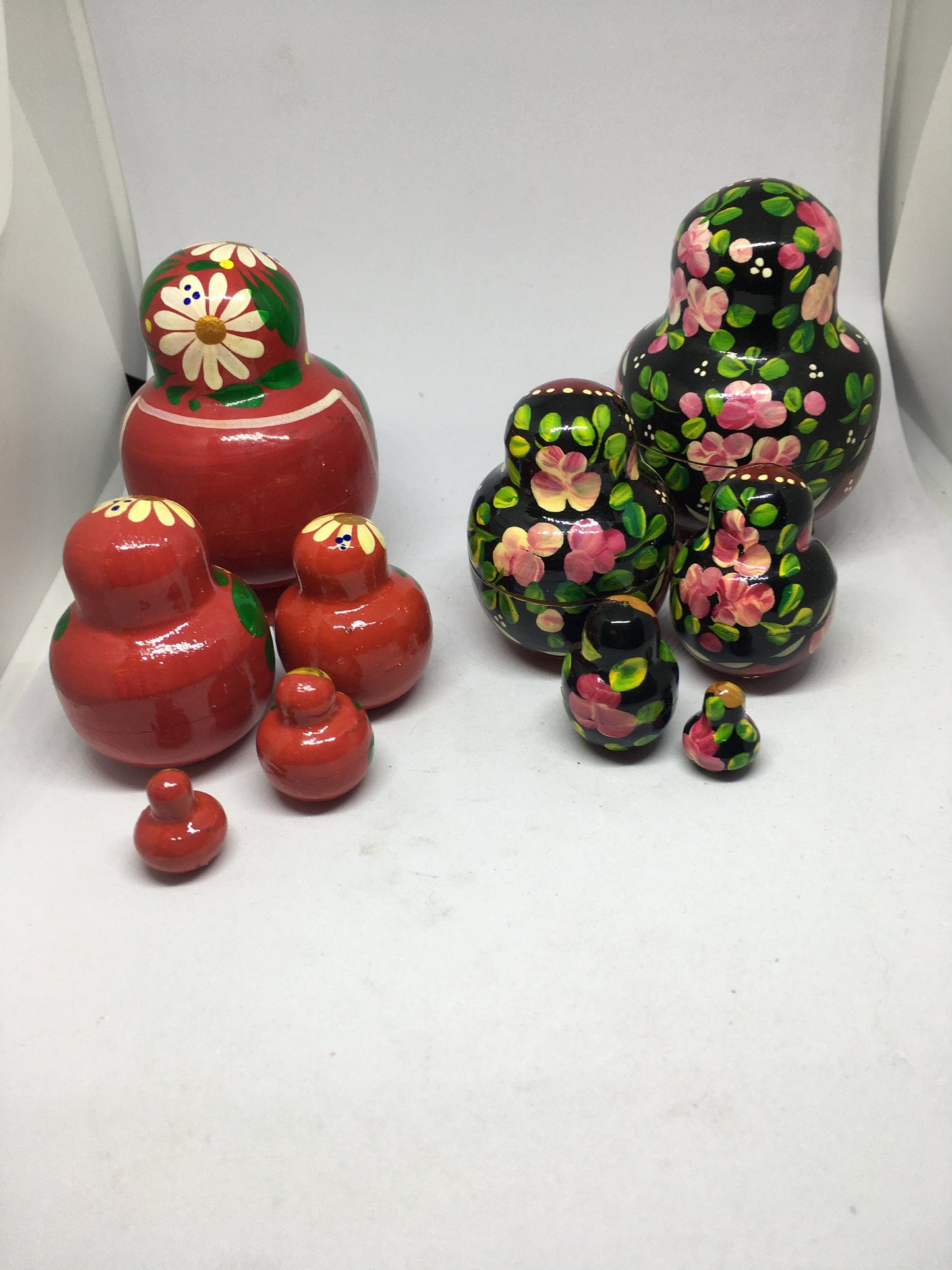 Matryoshka nesting dolls with 4 smaller dolls. Beautifully detailed floral designs. 1 available.