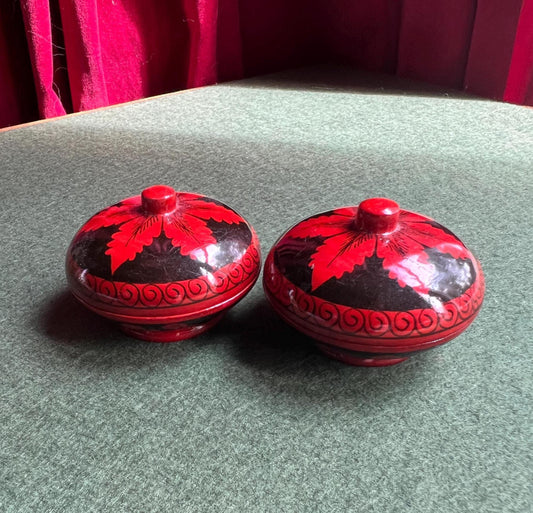 Pair of red and black lacquered lidded boxes. Tiny trinket ring boxes. Sold as a pair.