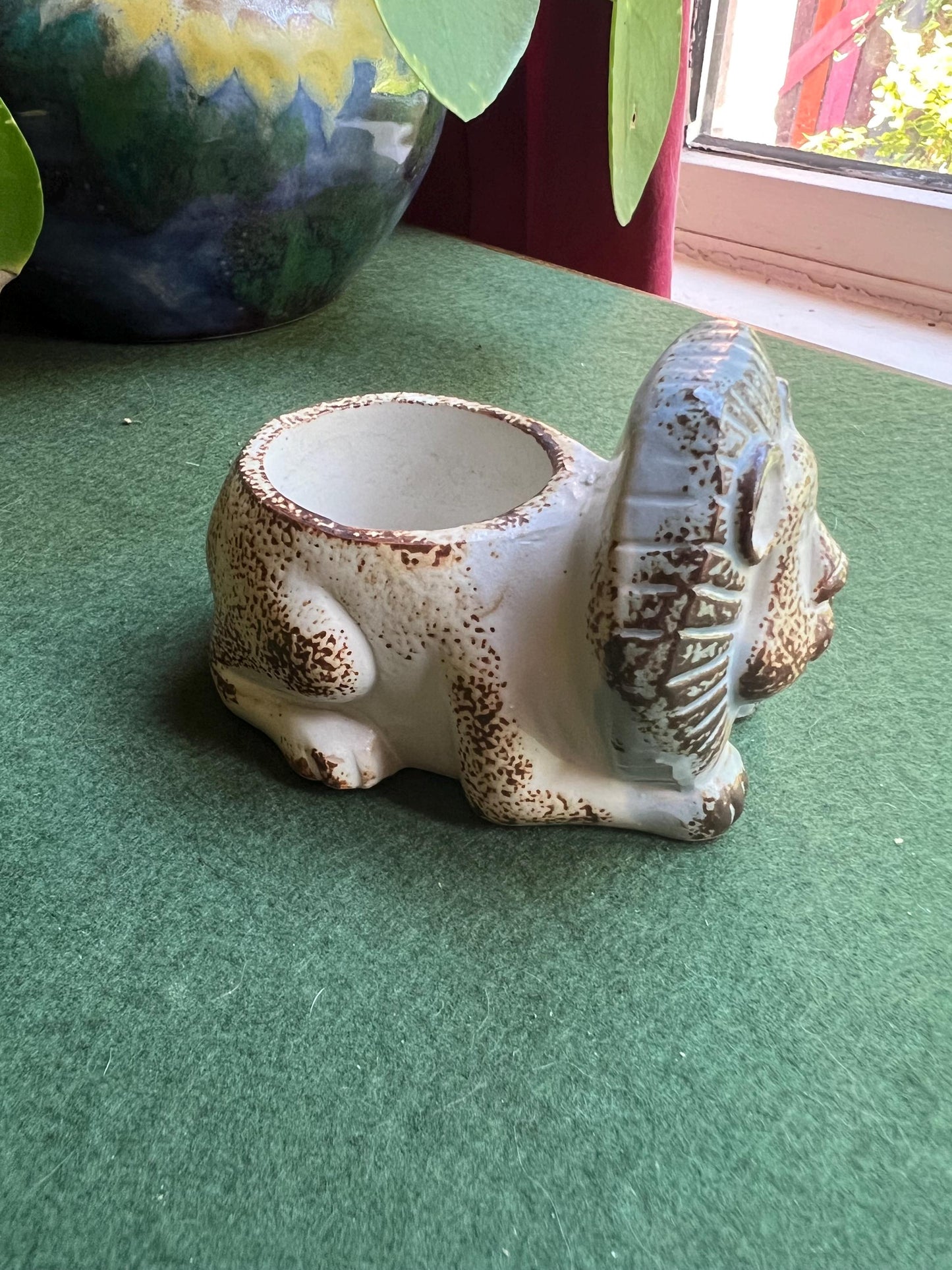 Stylised stone ware lion planter with original 'Julietta' Sticker.