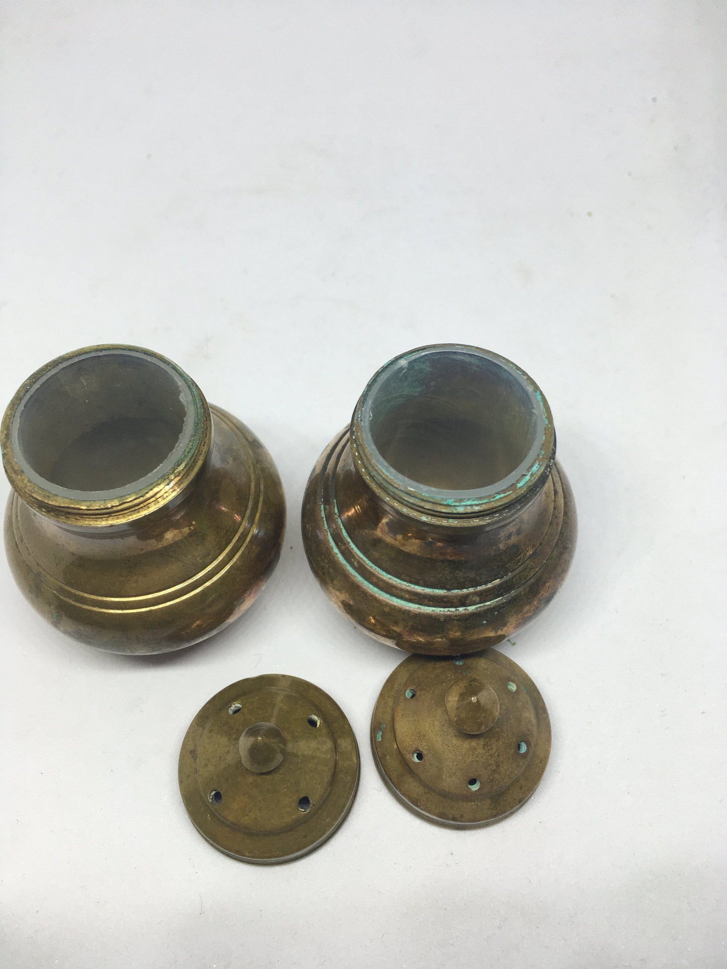 Unusual brass salt and pepper shakers. Screw off lids plastic inserts. Some oxidation.
