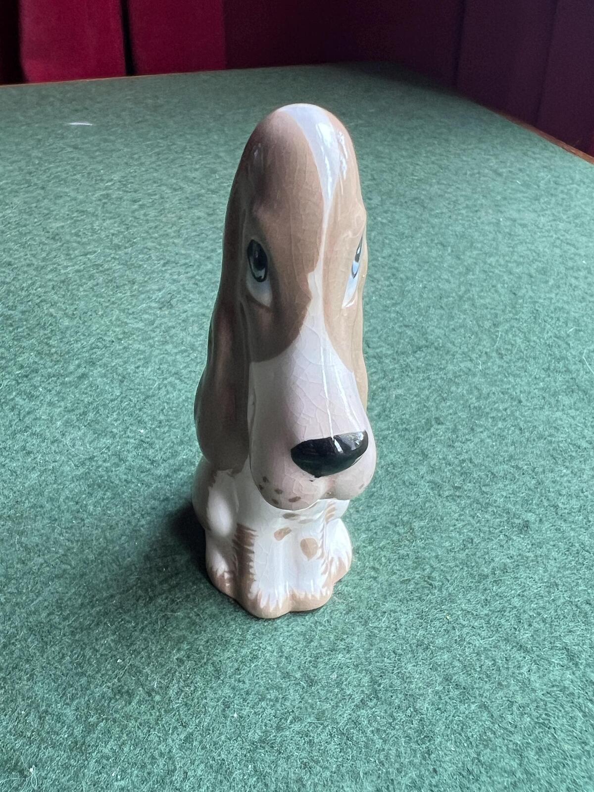 Vintage ceramic sad hound dog figurine. Stamped Szeiler