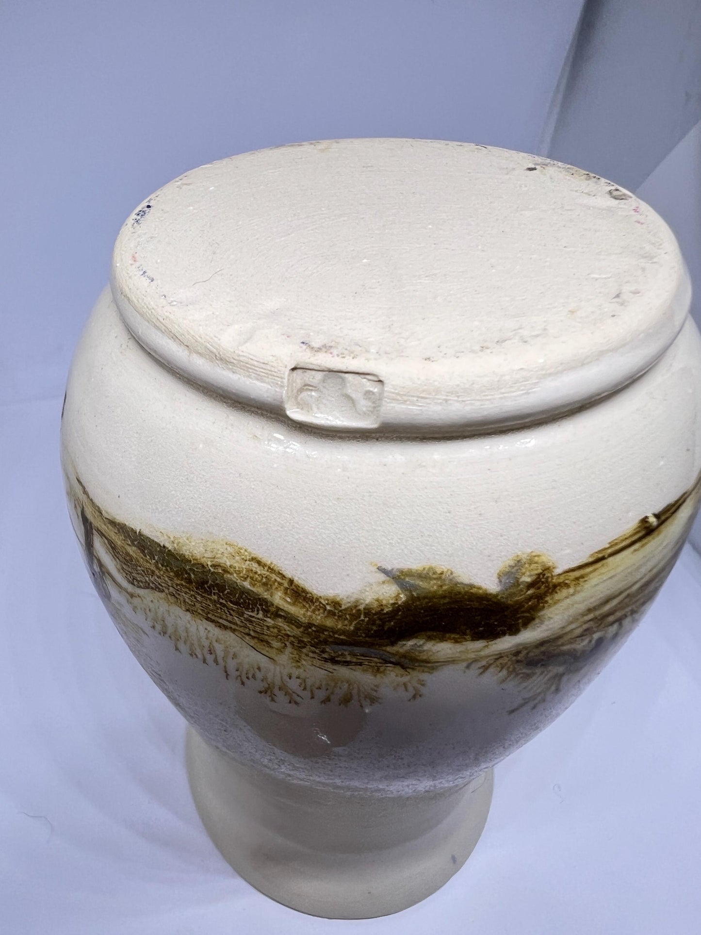 Studio pottery Mochaware lidded pot Cream glaze with tree design.