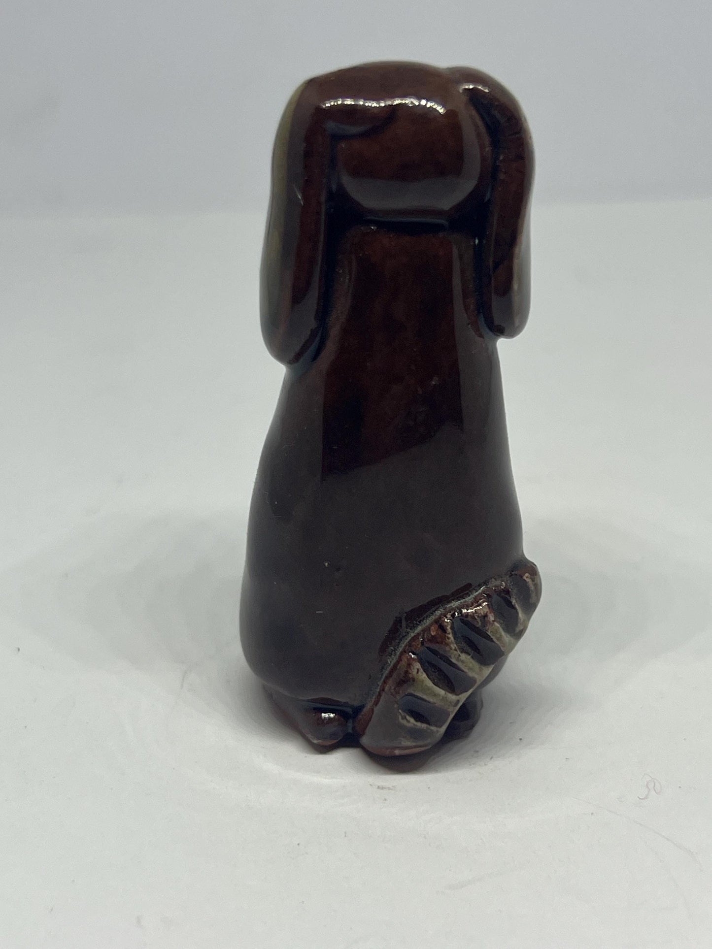 Tiny studio pottery dog figurine.