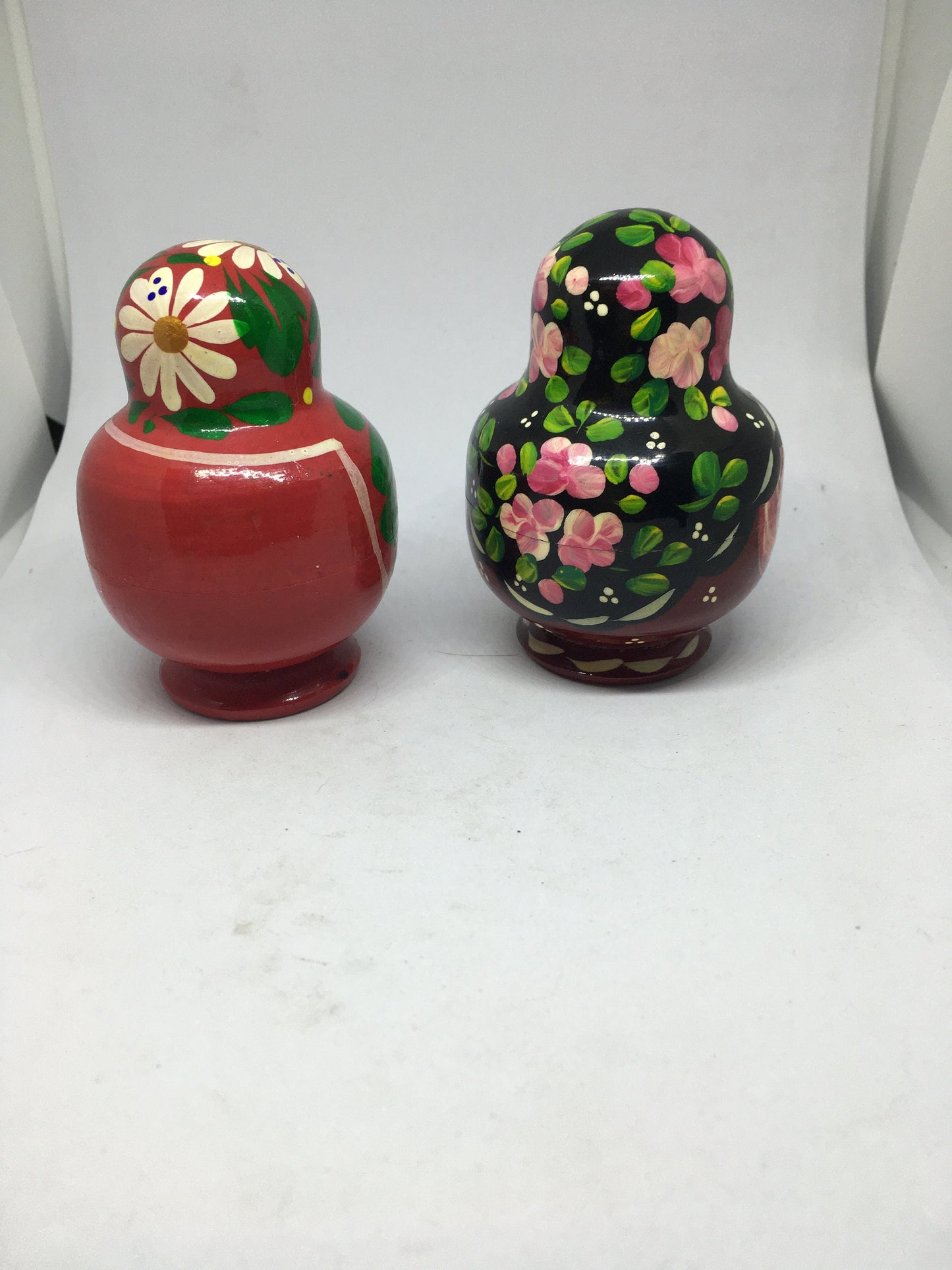Matryoshka nesting dolls with 4 smaller dolls. Beautifully detailed floral designs. 1 available.
