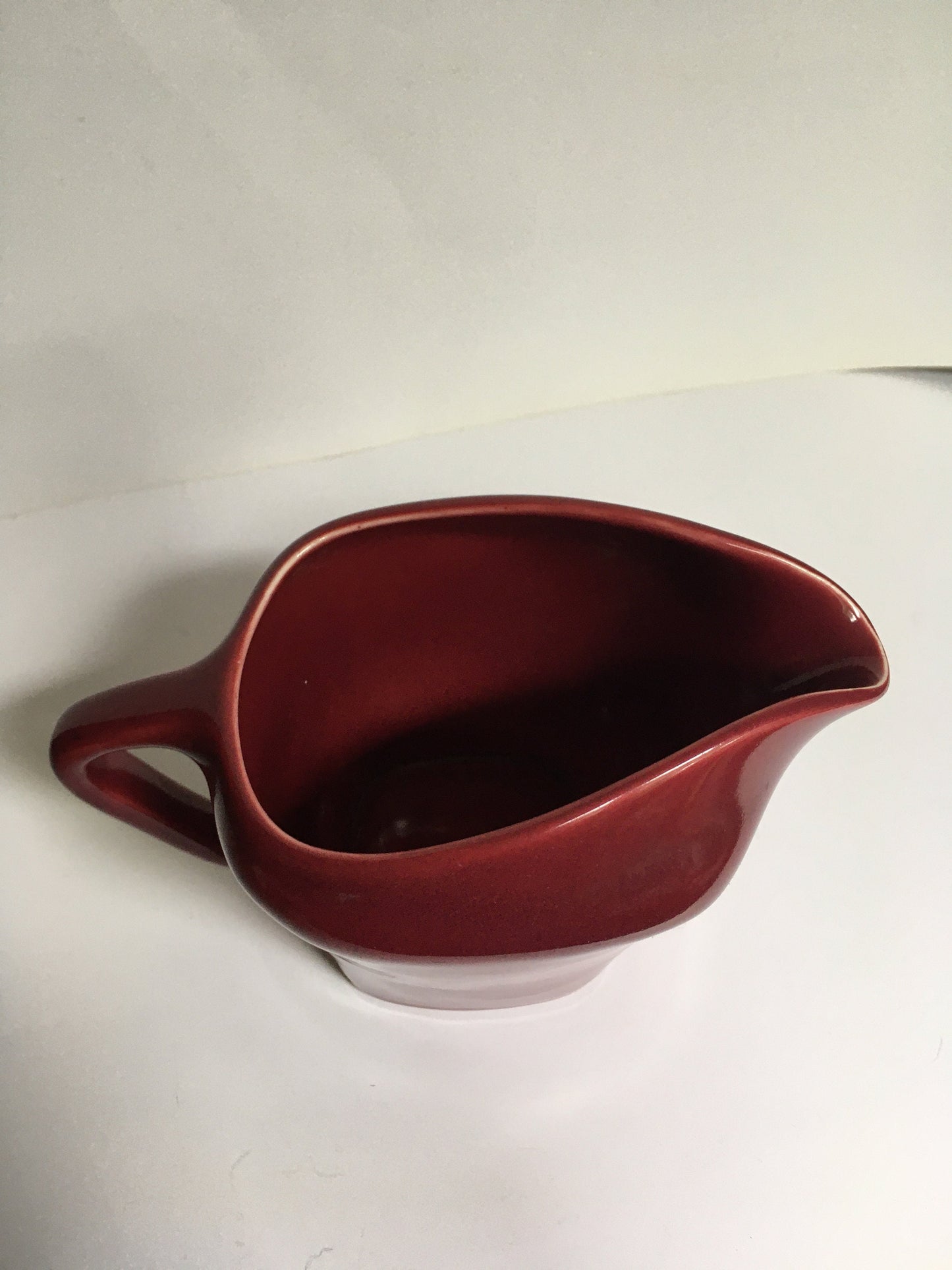 Rare Vintage red milk jug creamer Deep red glazed gravy custard serving jug. Stamped South Seas JG Meakin.