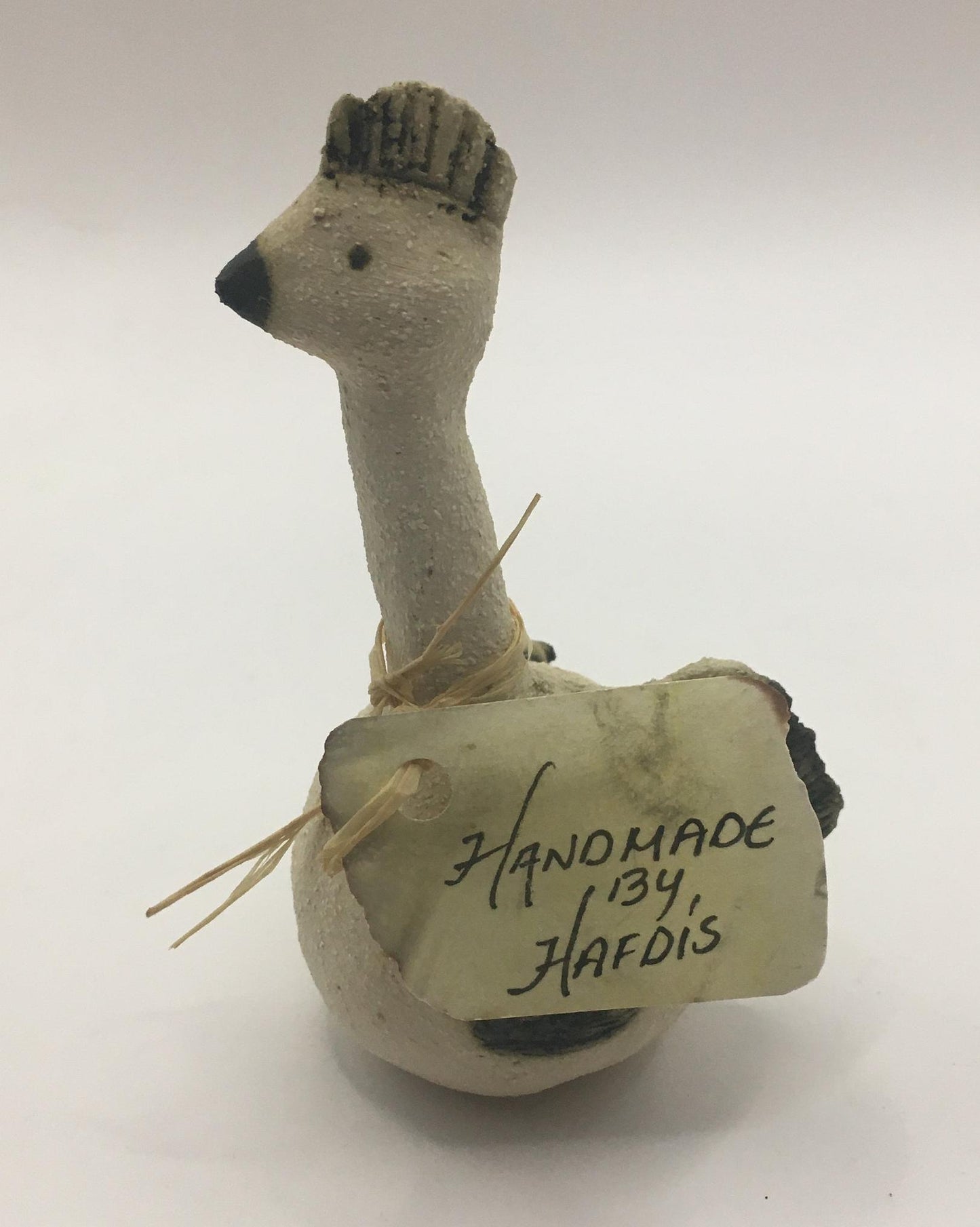 Quirky sitting bird with comb. Handmade by Hafdis.