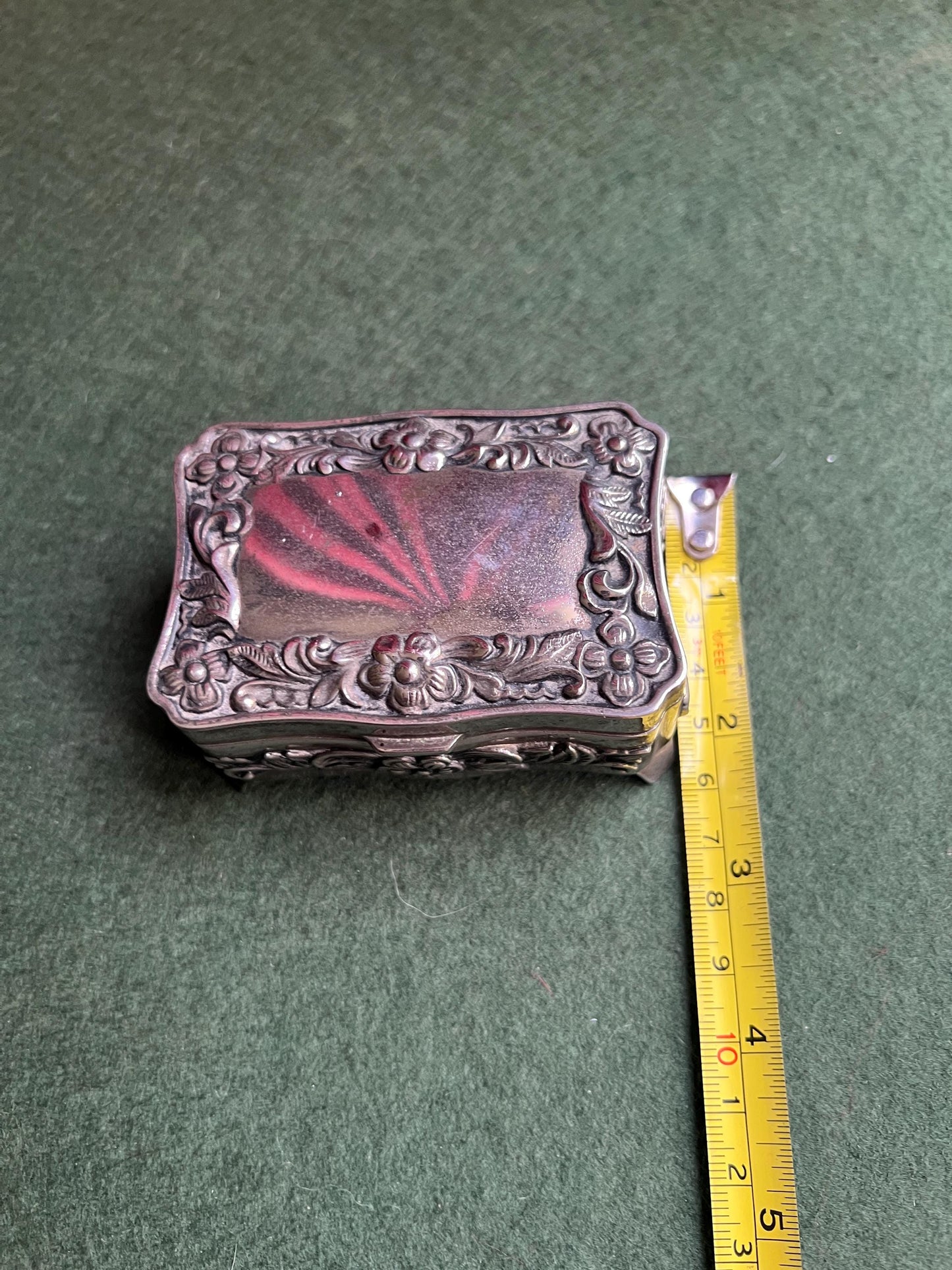 Vintage silver tone jewellery box. Embossed floral design treasure box blue lining.