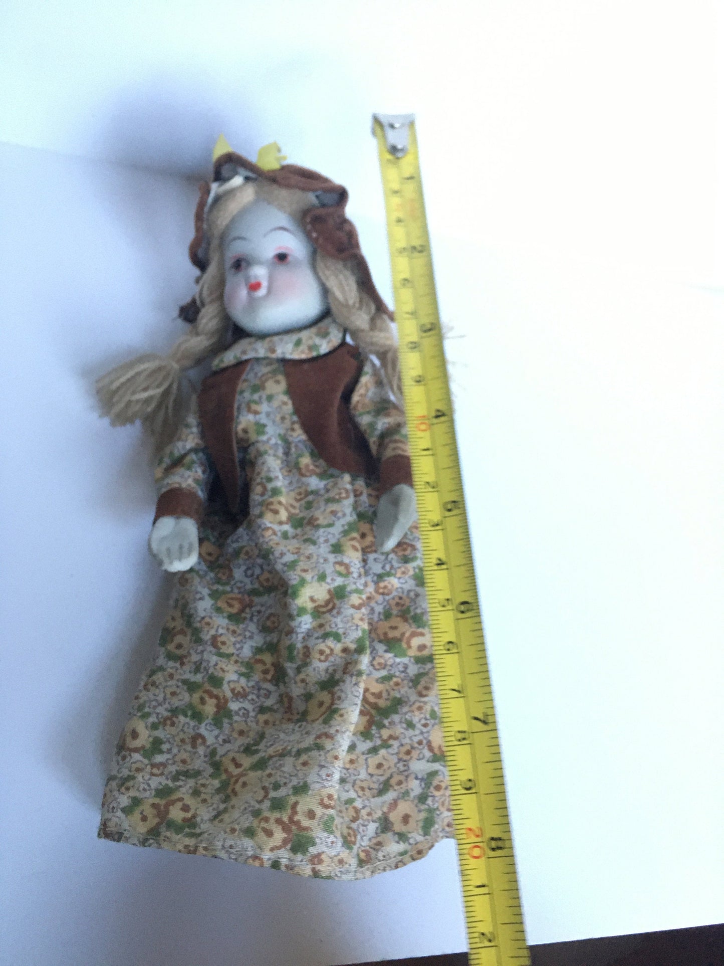 1970s ceramic doll in original clothes.