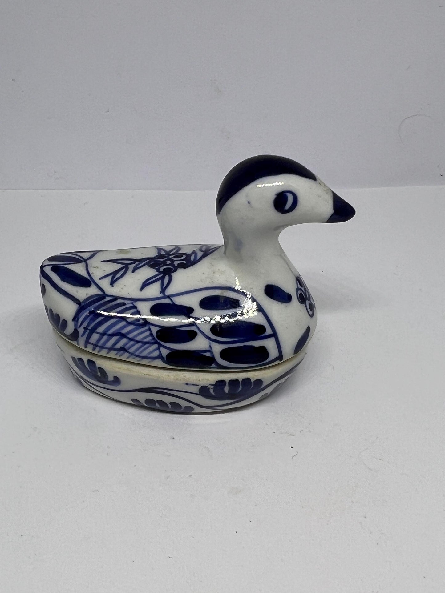 Miniature duck trinket box Blue white ceramic tiny duck.