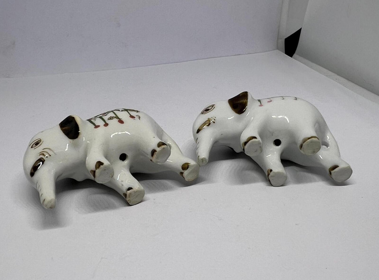Tiny pair ceramic elephants. Mini ceremonial dress with floral headdress