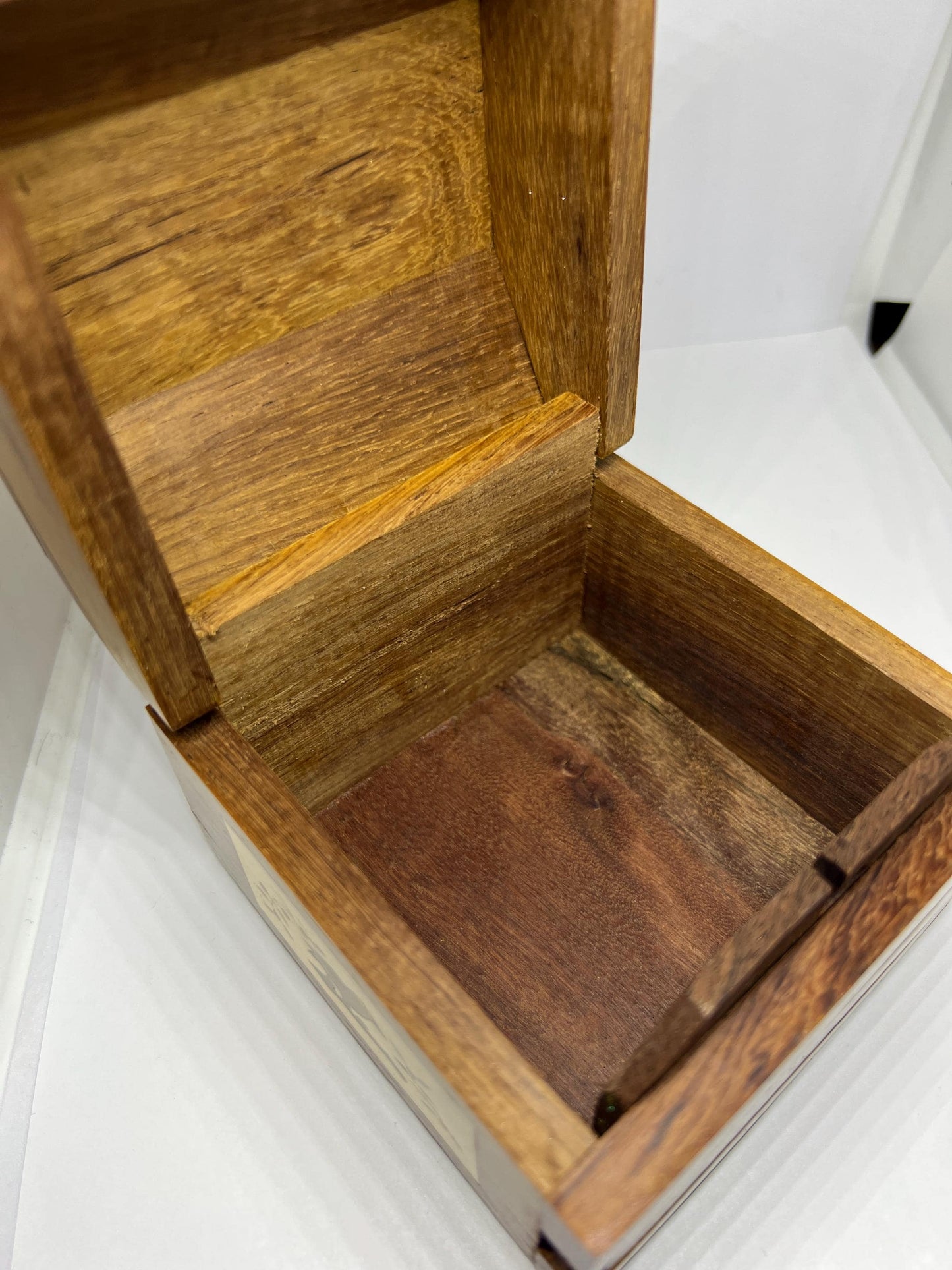 Wooden lidded secret lock treasure box. Inlaid marquetry bird themed domed jewellery box.