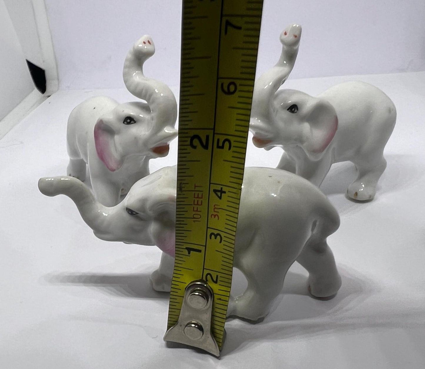 Ceramic elephant family. Lucky trunks raised mum dad and baby elephant collection.