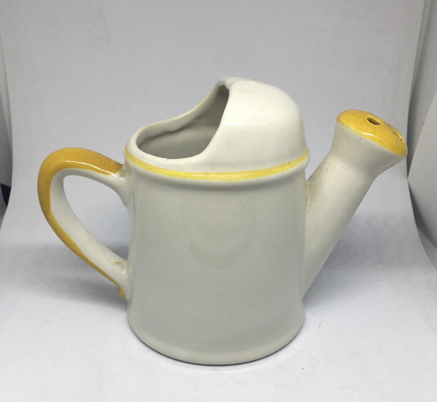 Ceramic watering can Vintage Gretchen Stoneware ceramic watering can ornament. 1970s kitsch. A smile is a frown turned upside down.