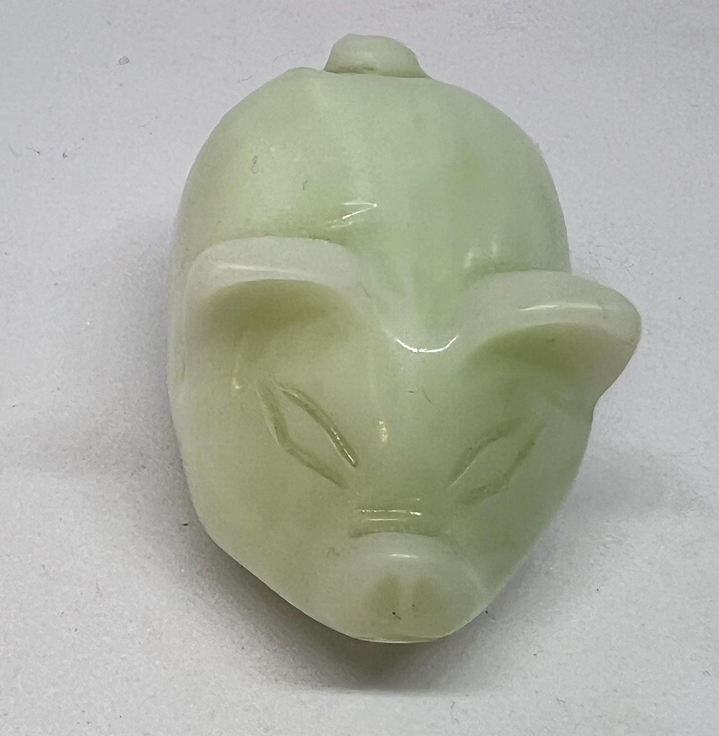 Vintage jade pig figurine. Cute carved white stone jade piglet ornament.