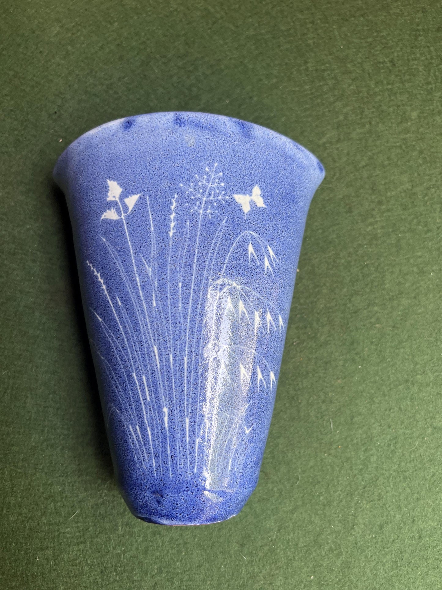 Studio pottery wall pocket. Blue glaze posy vase floral butterfly decor.