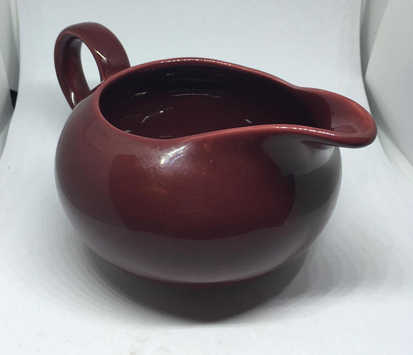 Vintage deep red Poole Pottery milk jug creamer sauce boat.