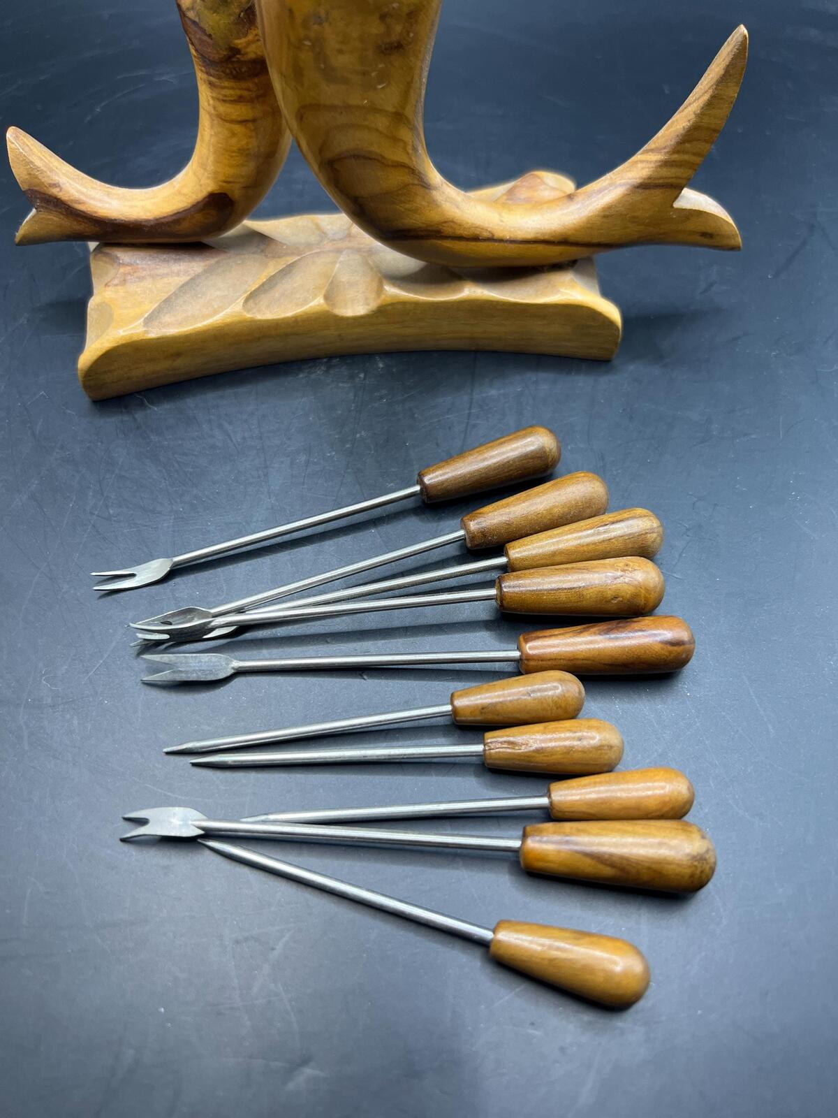 Wooden olive serving set. MCM carved olive wood fish design with 6 forks and 4 picks.