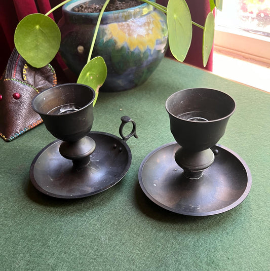 Vintage black metal thumb hold candle holder. Made in India stickers.