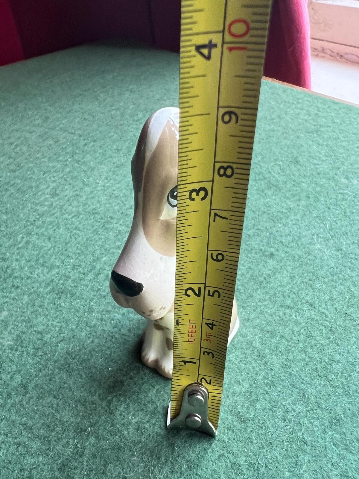 Vintage ceramic sad hound dog figurine. Stamped Szeiler