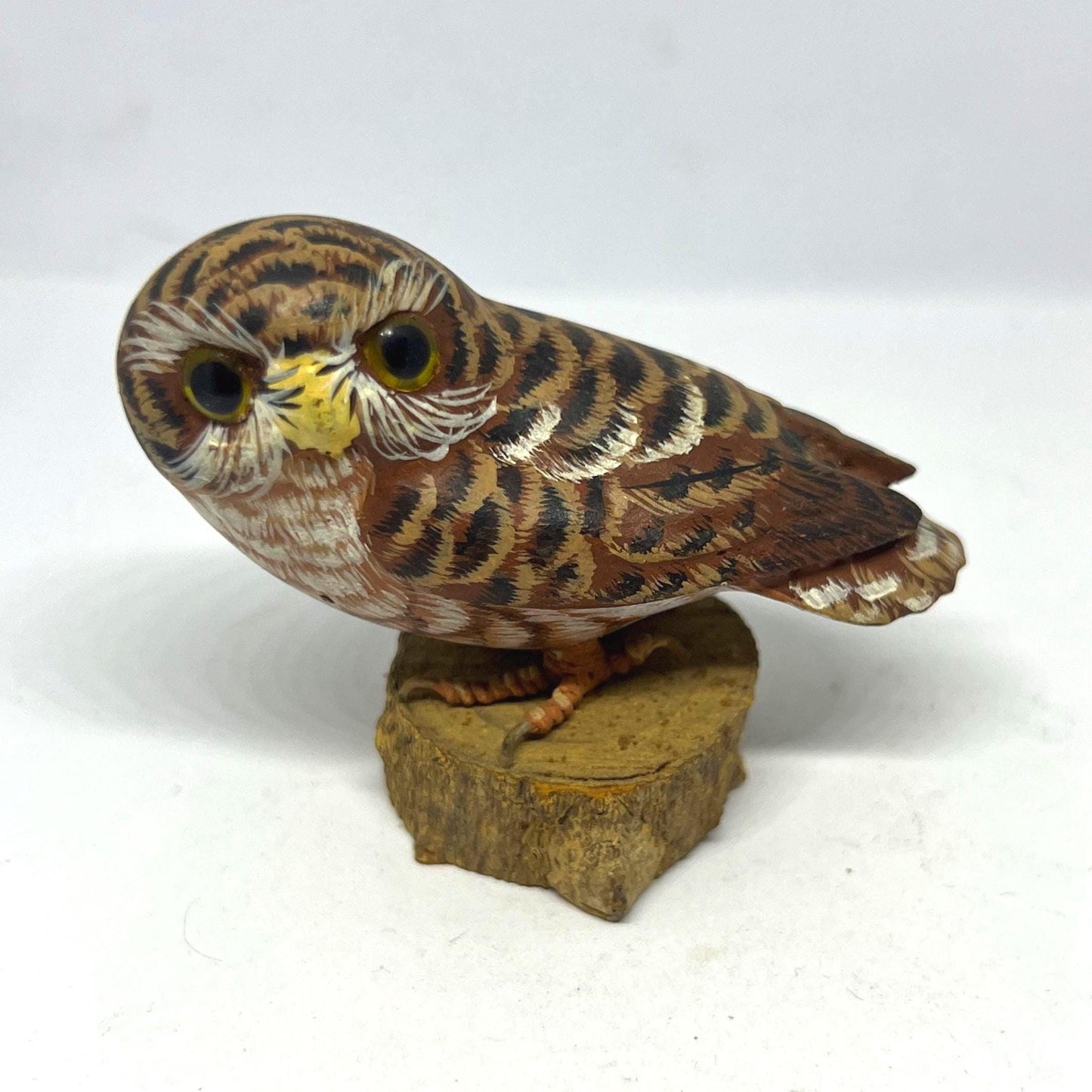 Vintage Hand Carved Wood Saw Whet Owl Hand painted with glass eyes on tree stump base.