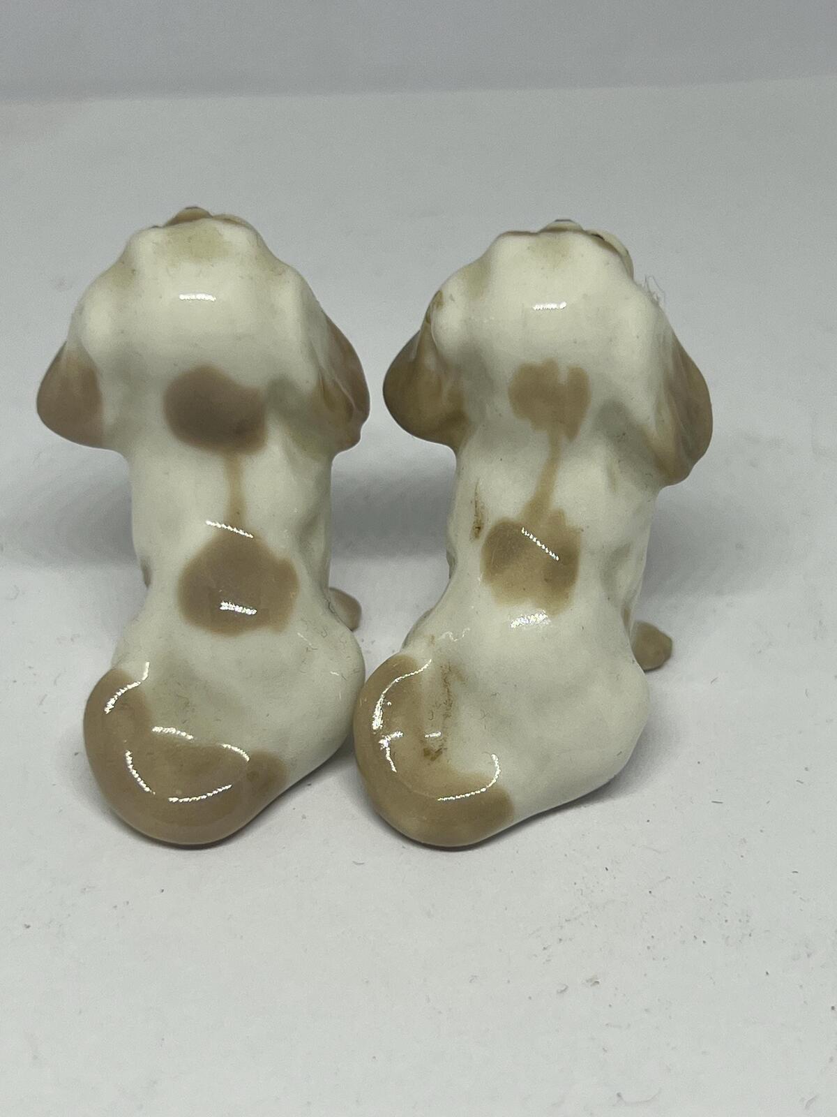 Pair of miniature Pekinese or Bolognese dogs. Hand painted Porcelain Lomonosov USSR dog figurines.