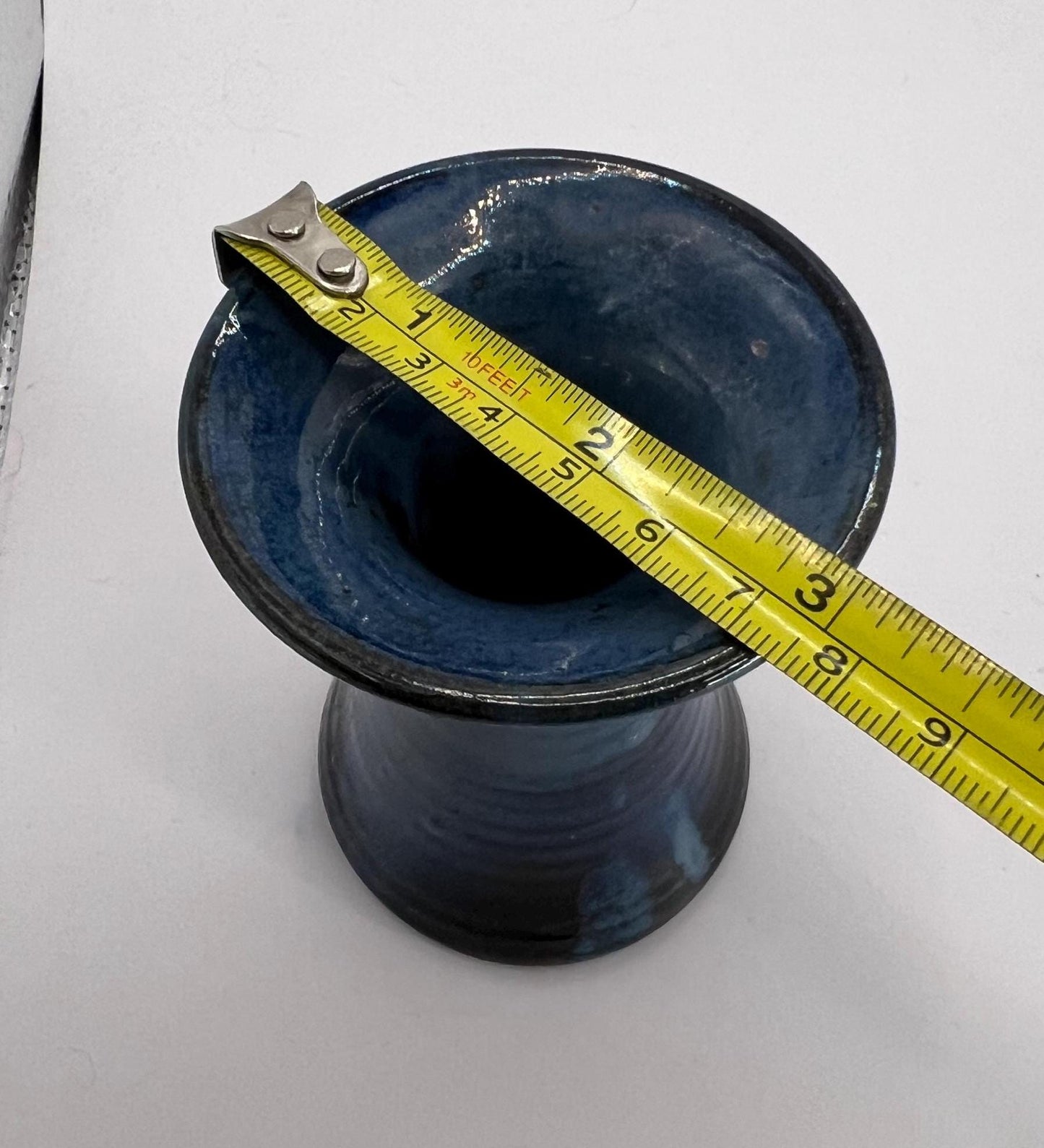 Blue black glaze trumpet vase. Marked 'aino'.