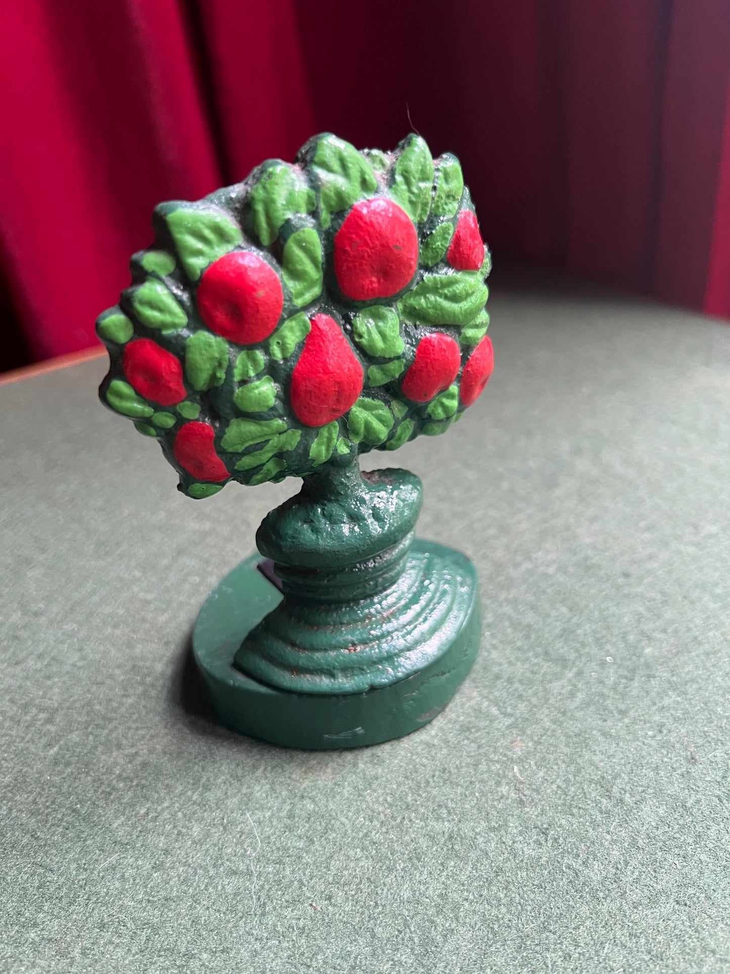 Vintage cast iron door stop. Hand painted red green Apple tree door wedge.