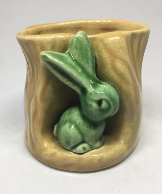 Campsie Ware green bunny by a tree stump planter vase.