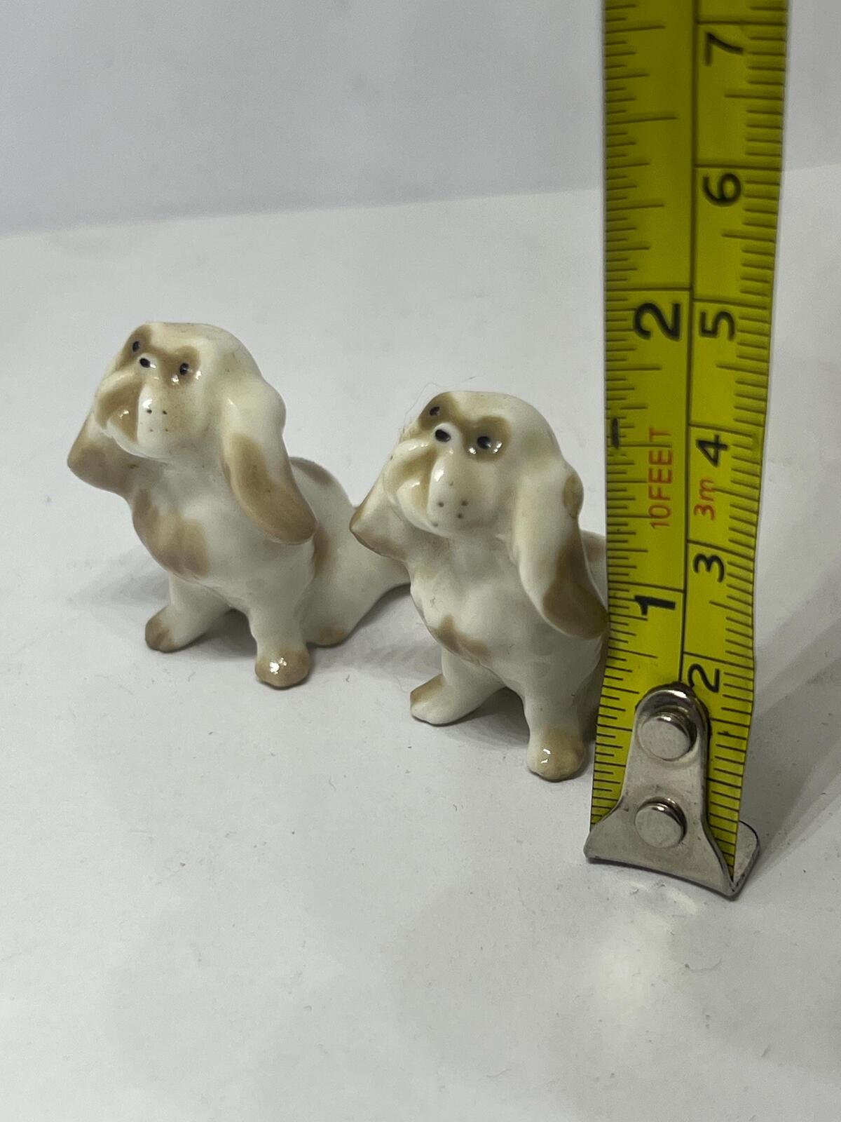 Pair of miniature Pekinese or Bolognese dogs. Hand painted Porcelain Lomonosov USSR dog figurines.