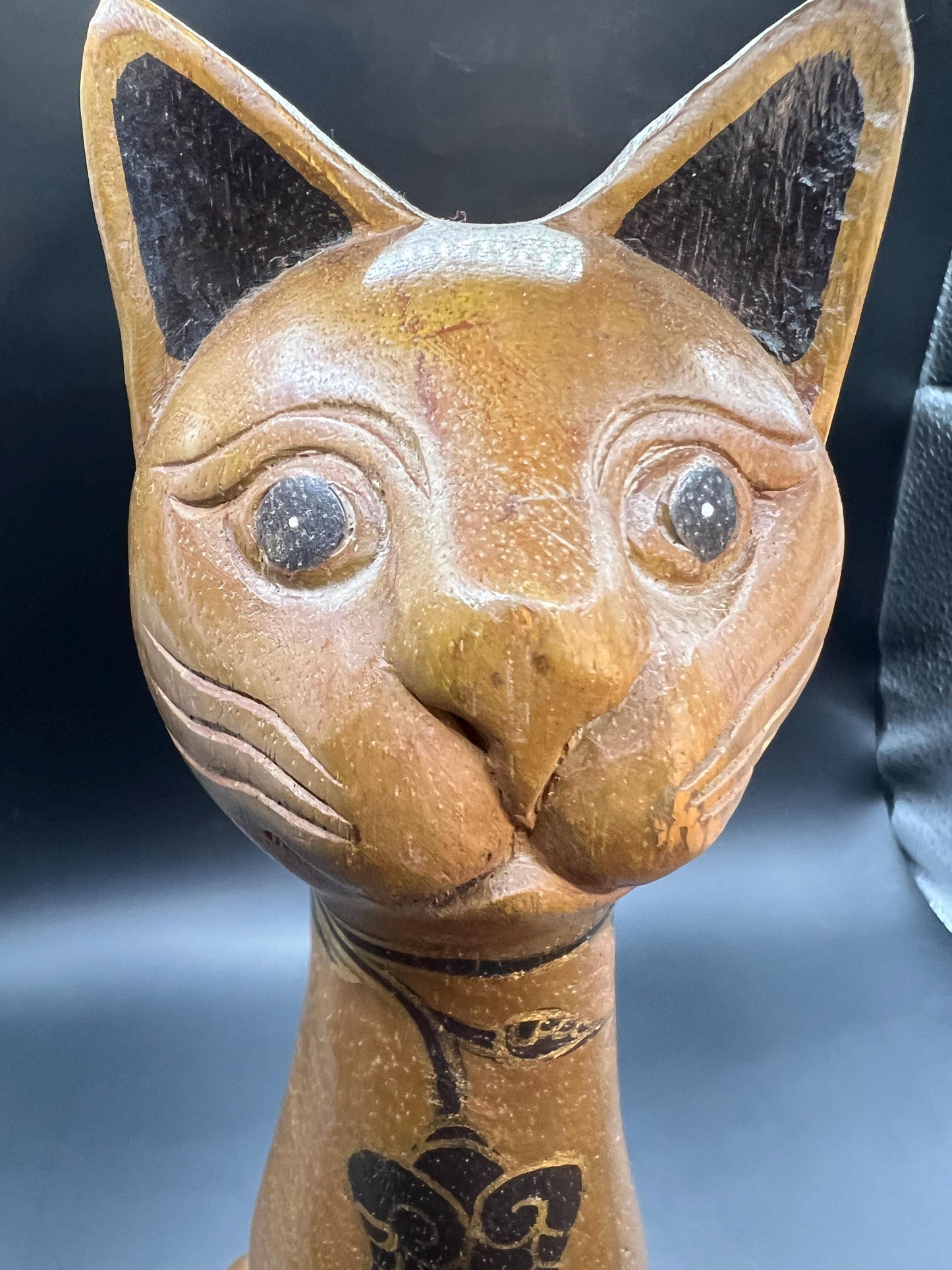 Hand carved wooden cat figurine. Made in Thailand.