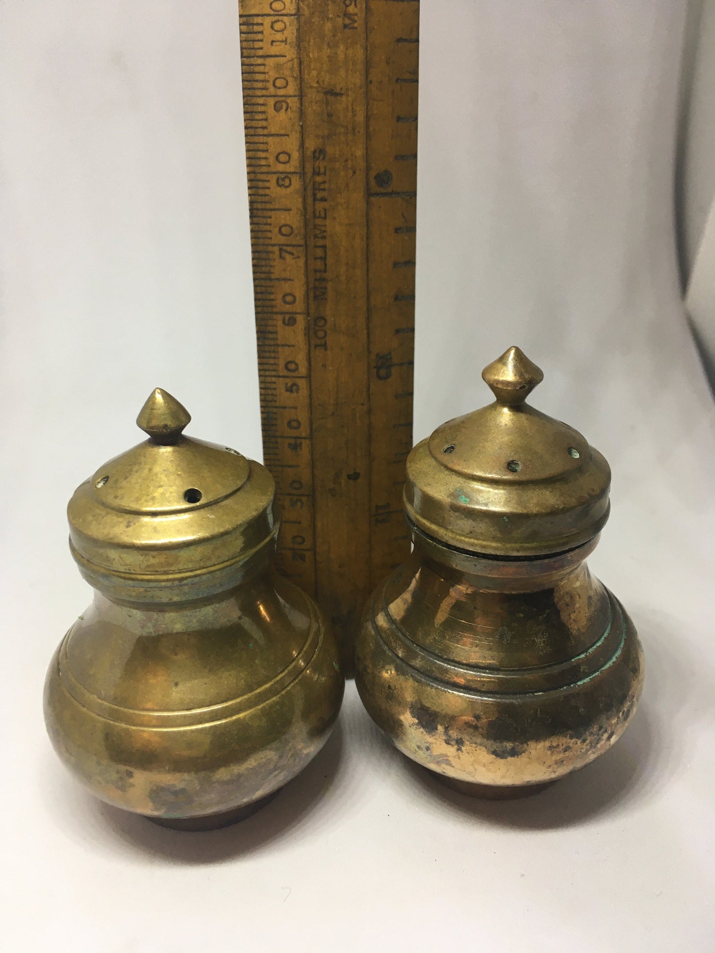 Unusual brass salt and pepper shakers. Screw off lids plastic inserts. Some oxidation.