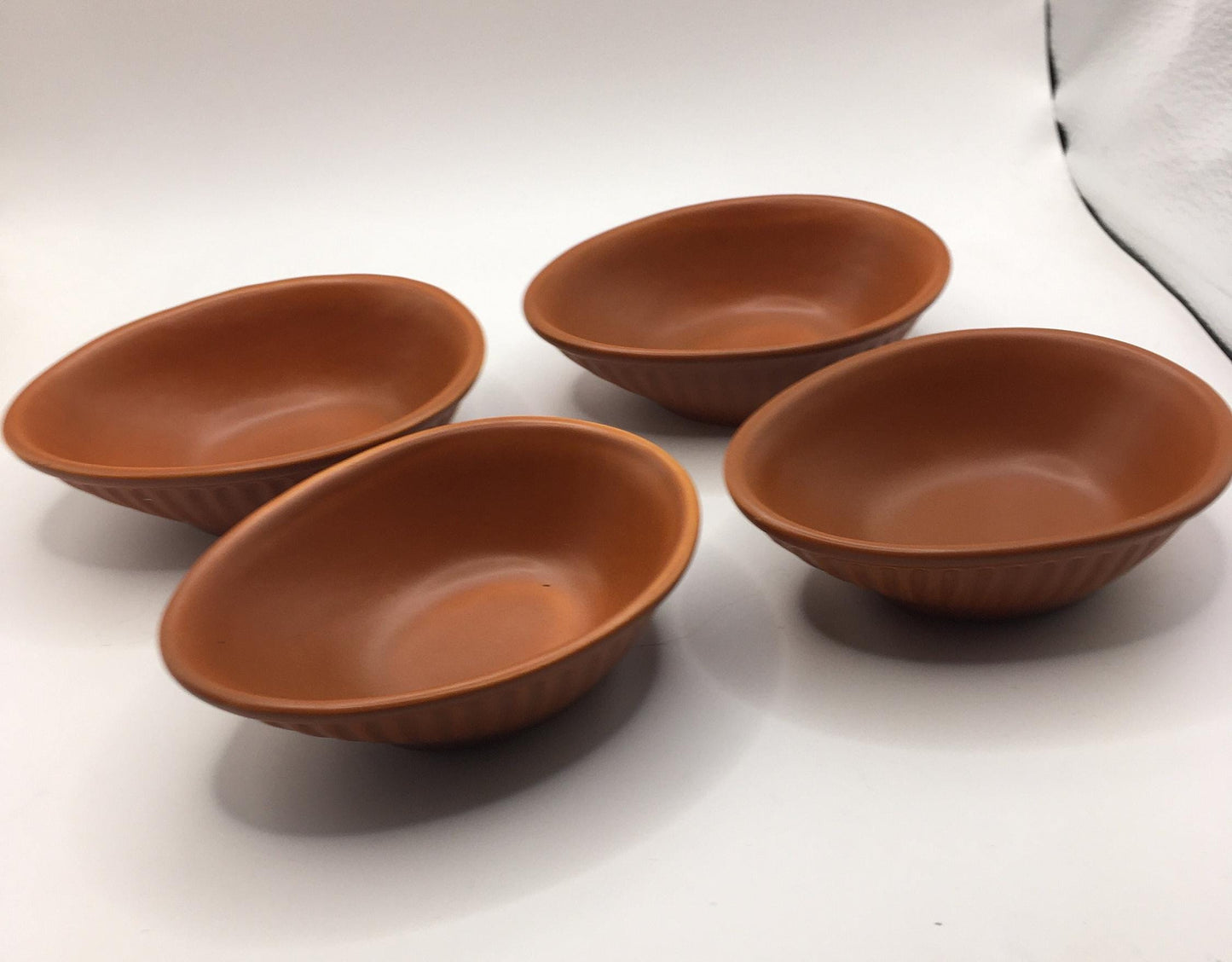 Honiton Pottery Avocado dishes. Set of 4 orange glazed stripe edged set.