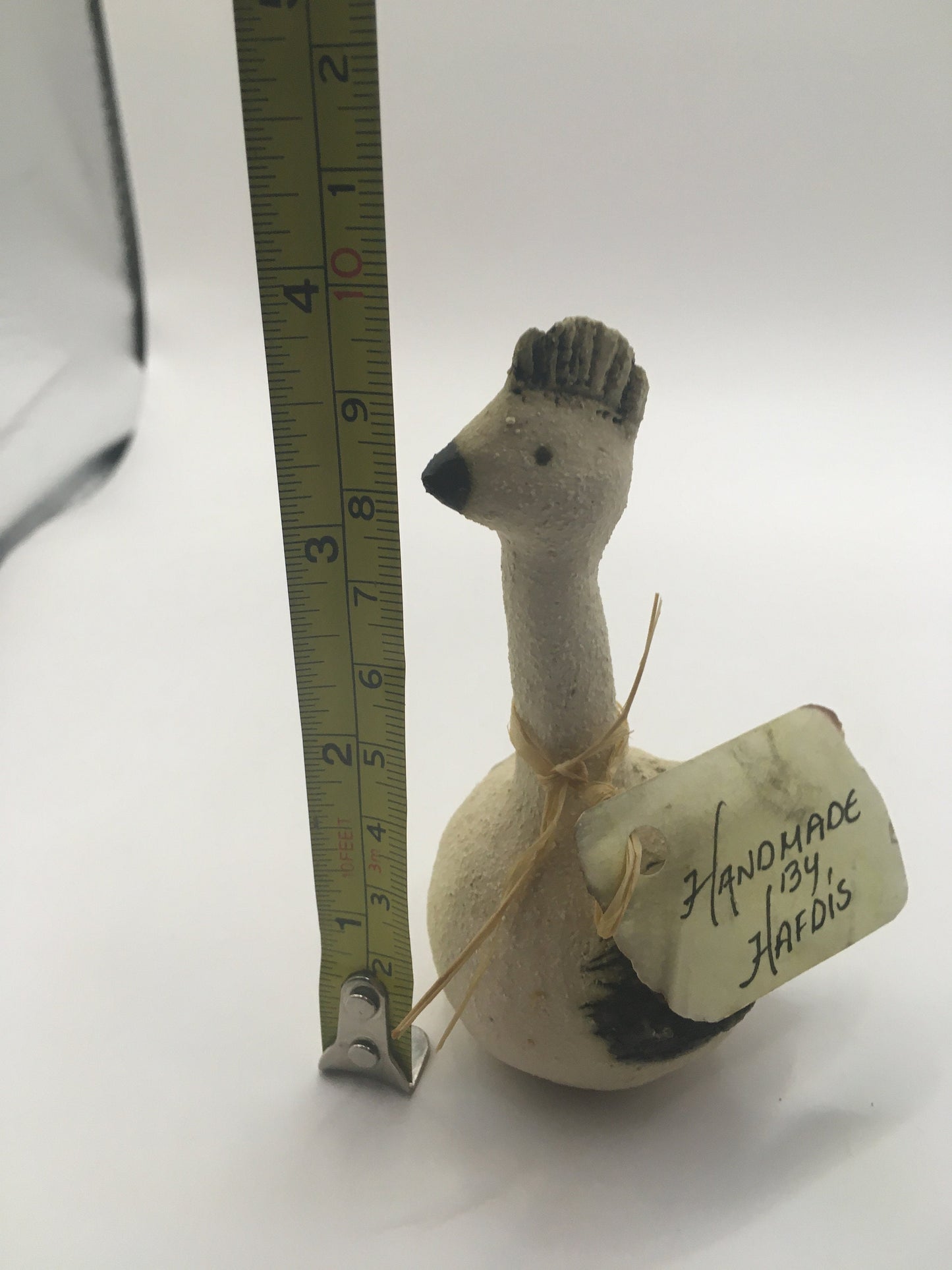 Quirky sitting bird with comb. Handmade by Hafdis.