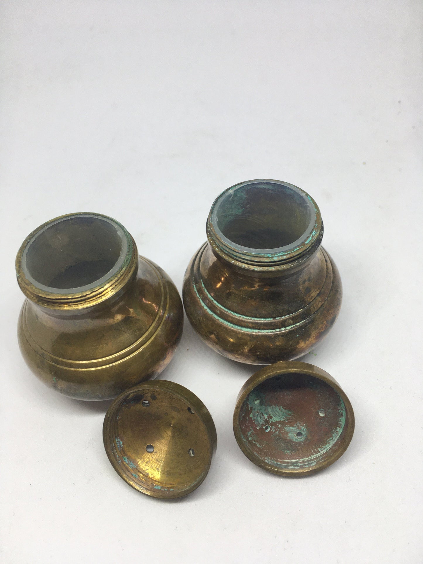 Unusual brass salt and pepper shakers. Screw off lids plastic inserts. Some oxidation.