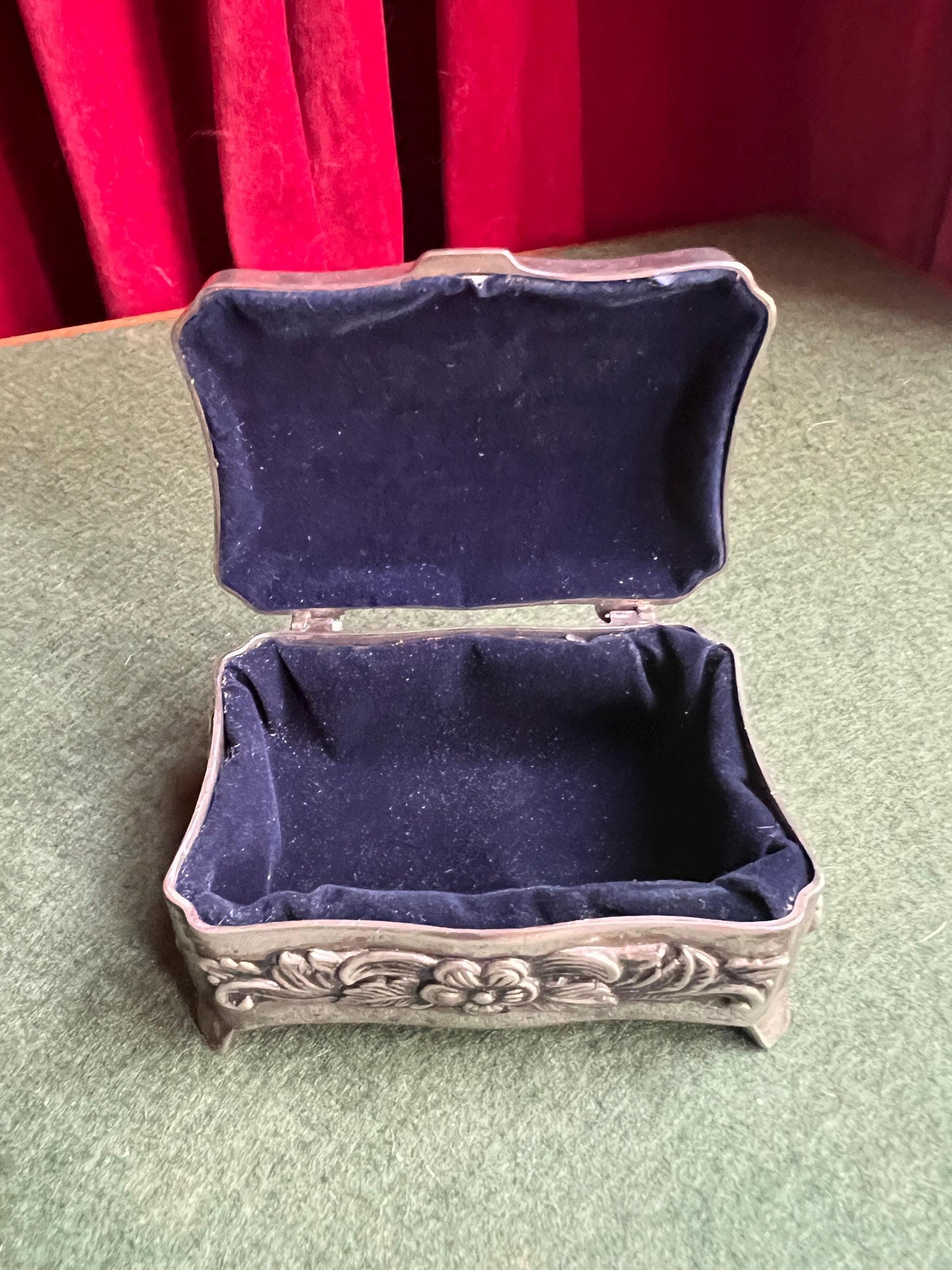 Vintage silver tone jewellery box. Embossed floral design treasure box blue lining.