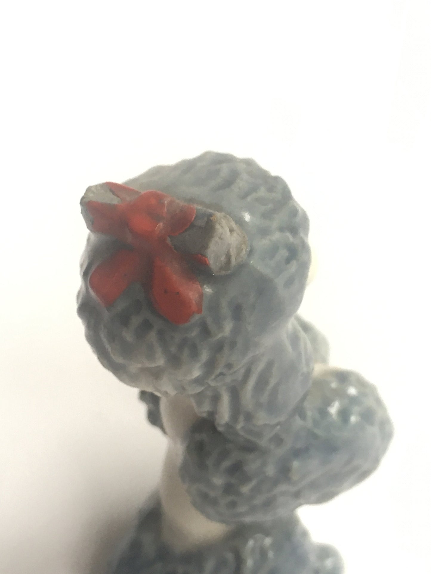 Wade Poodle. Vintage ceramic begging poodle with a red bow.