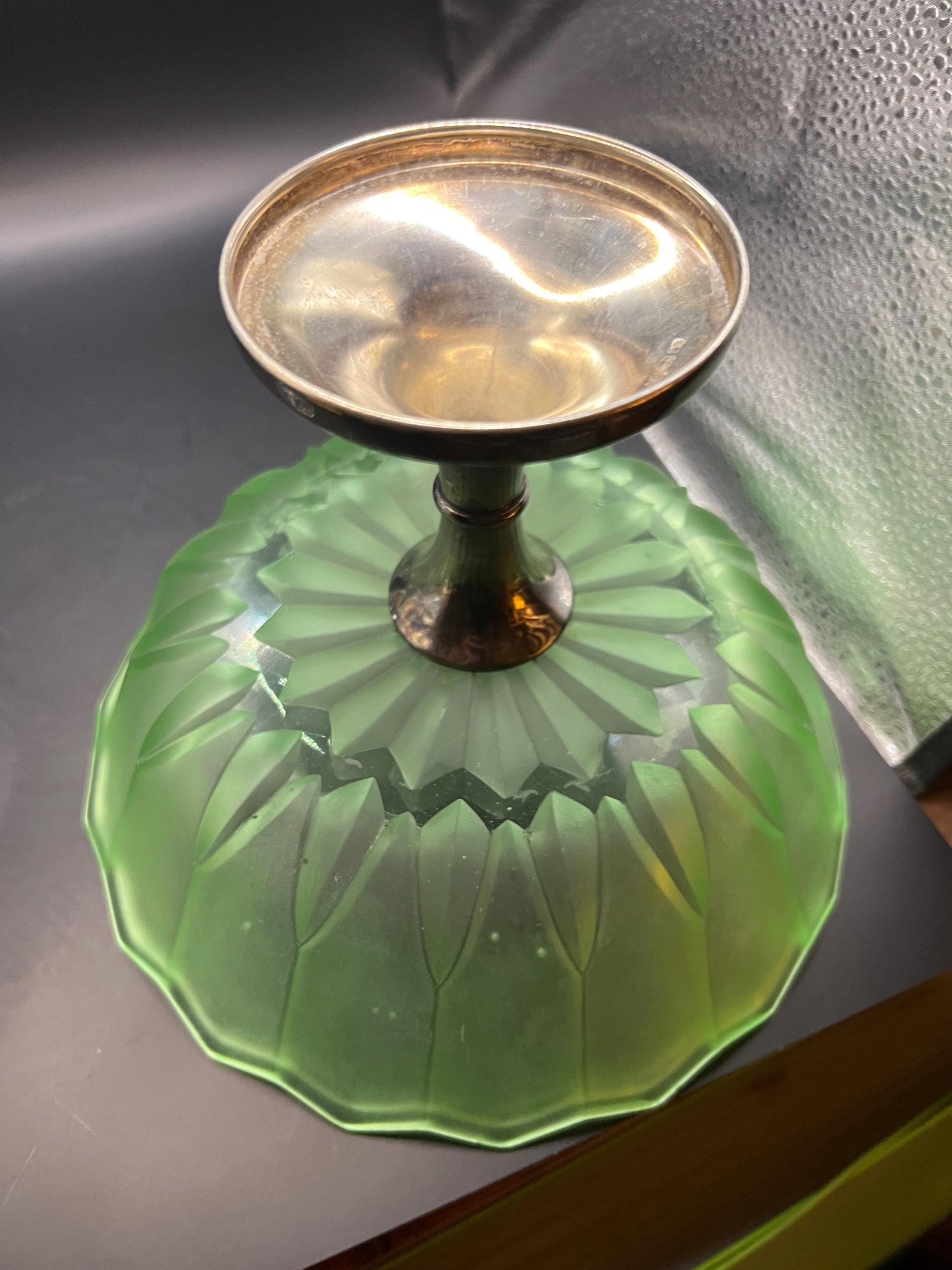 1930s green stretch glass pedestal bowl on silver tone base.