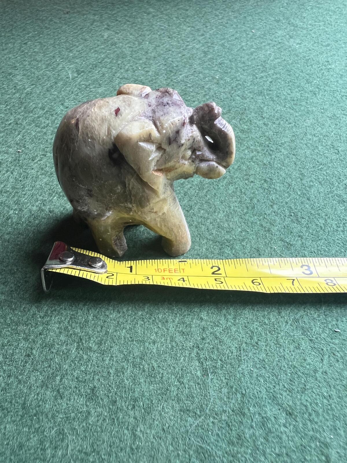 Stone elephant figure. Miniature marble hand carved lucky elephant.