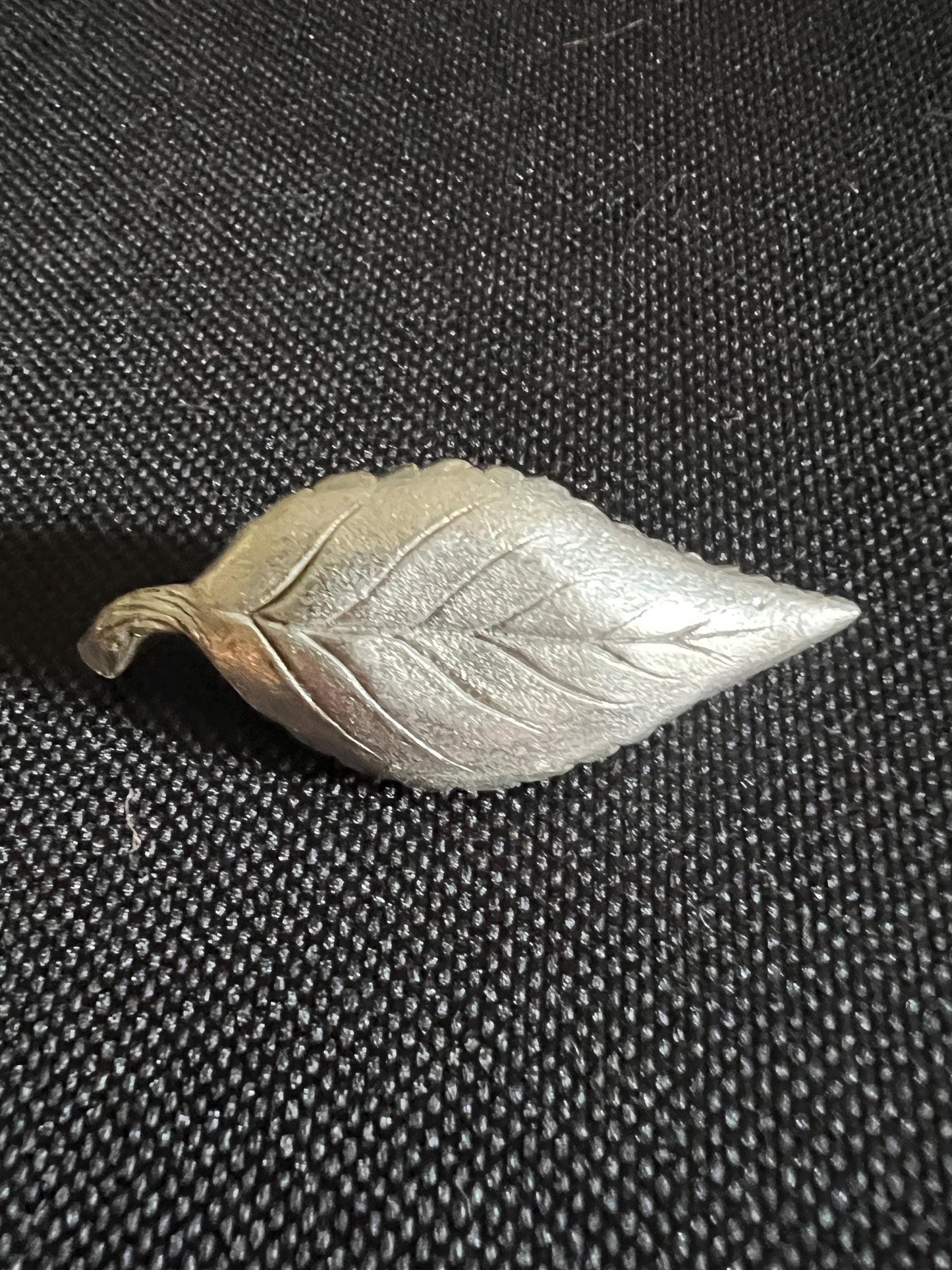 Tiny koala sleeping on a leaf. Pewter miniature figurine.