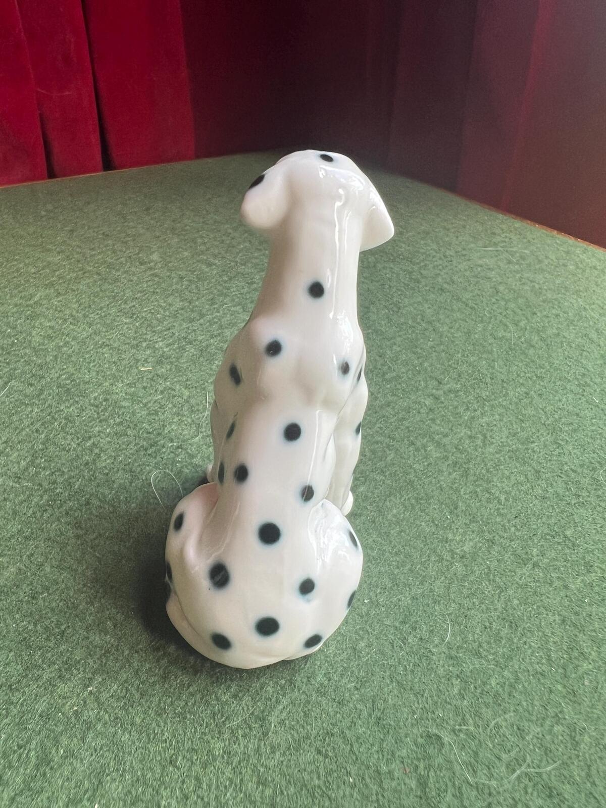 Vintage ceramic dalmatian dog figurine. Porcelain black and white spotty dog.