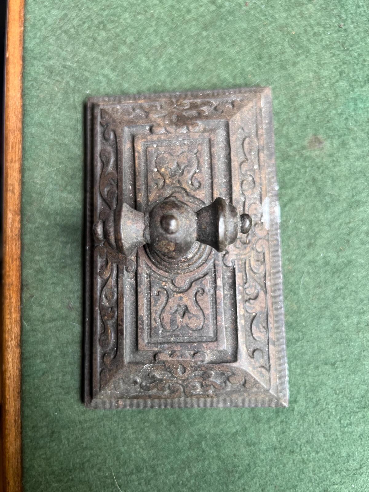 Ornate antique cast iron paperweight. Handled Victorian paperweight doorstop. Decorative pyramid swirl patterned quirky paperweight.
